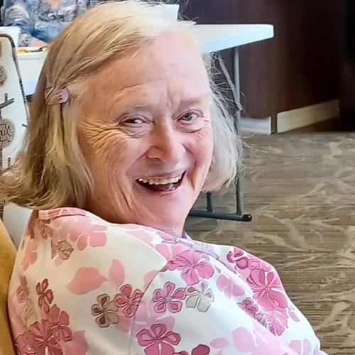 Resident relaxing in a lounge at The Oxford Grand Assisted Living & Memory Care in Wichita, Kansas