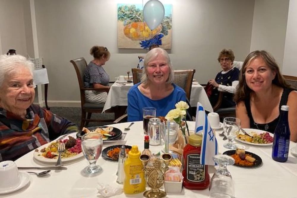 Three people enjoying Dinner Night in the Dining Room