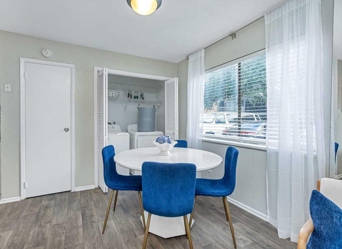 A spacious dining room with a large window at Barringer Square in Webster, Texas