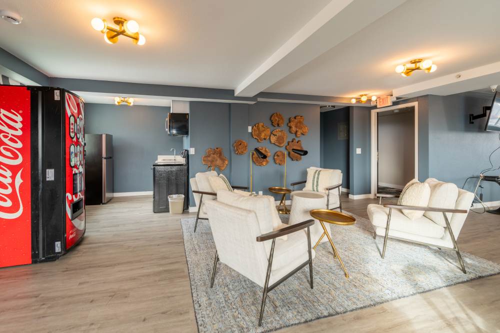 Socialize, grab a drink or play games in the clubroom at Thea Apartments in Tacoma, Washington