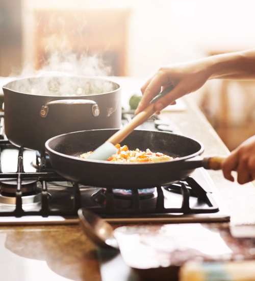 Resident cooking at Countryshire Estates in Rochester, New York