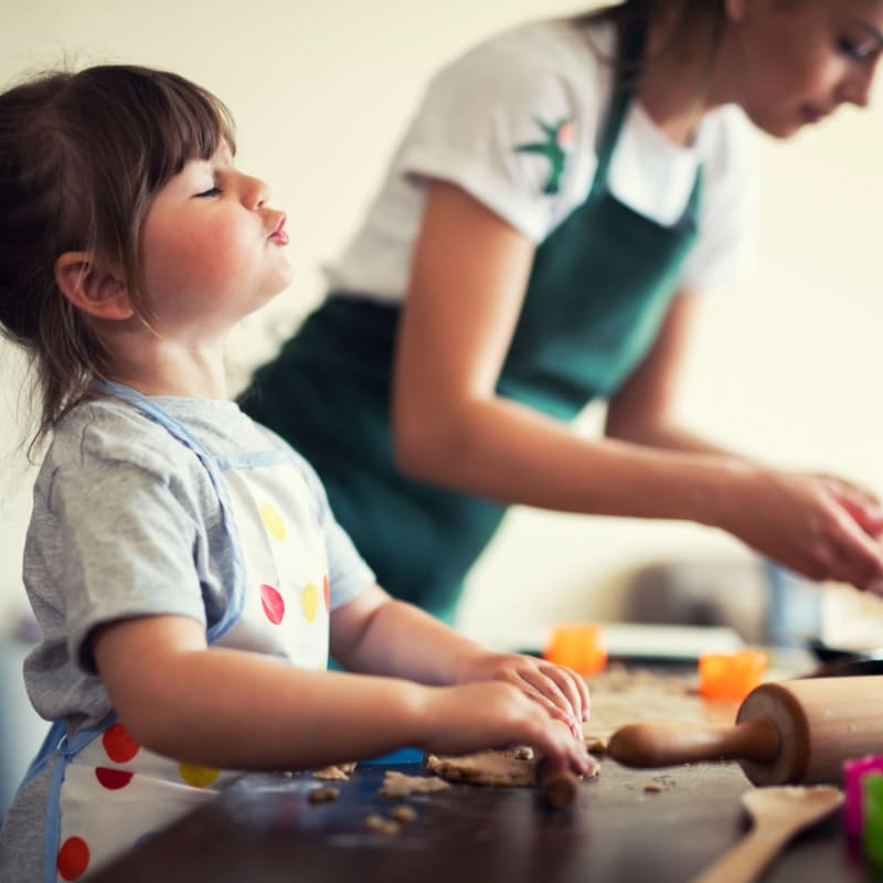 Mother and daughter making cookies at Capistrano Park in Modesto, California