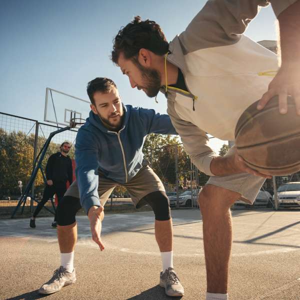 Residents playing basketball at The Quarters at Stillwater in Stillwater, Oklahoma