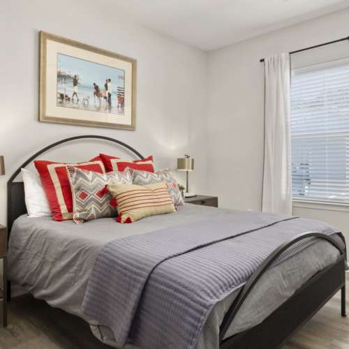 Spacious bedroom with large comfortable bed and large window at Hudson at Carolina Colours in New Bern, North Carolina