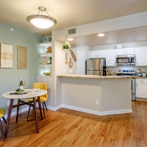 Kitchen and dining area at UTE Creek Apartments in Longmont, Colorado
