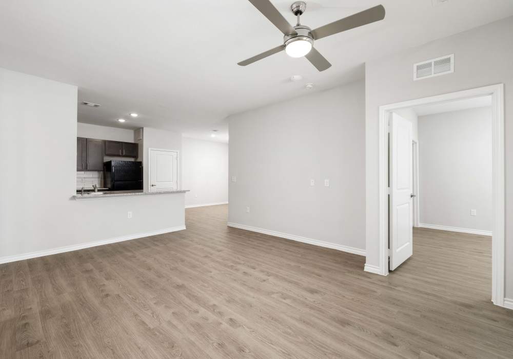 Unfurnished living room with an elegant neutral color palette at Walnut Springs in Seguin, Texas