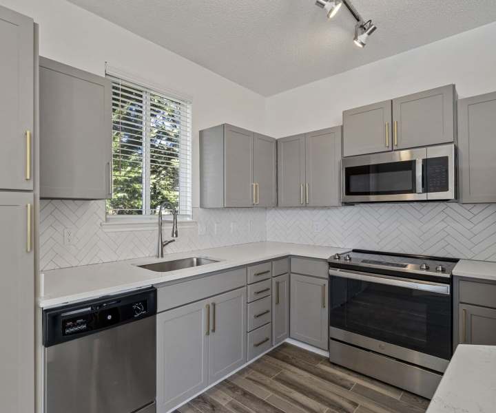 Model apartment kitchen at Chandler At University Tower in Durham, North Carolina