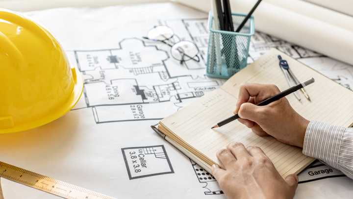 Architect working on a home addition plan 