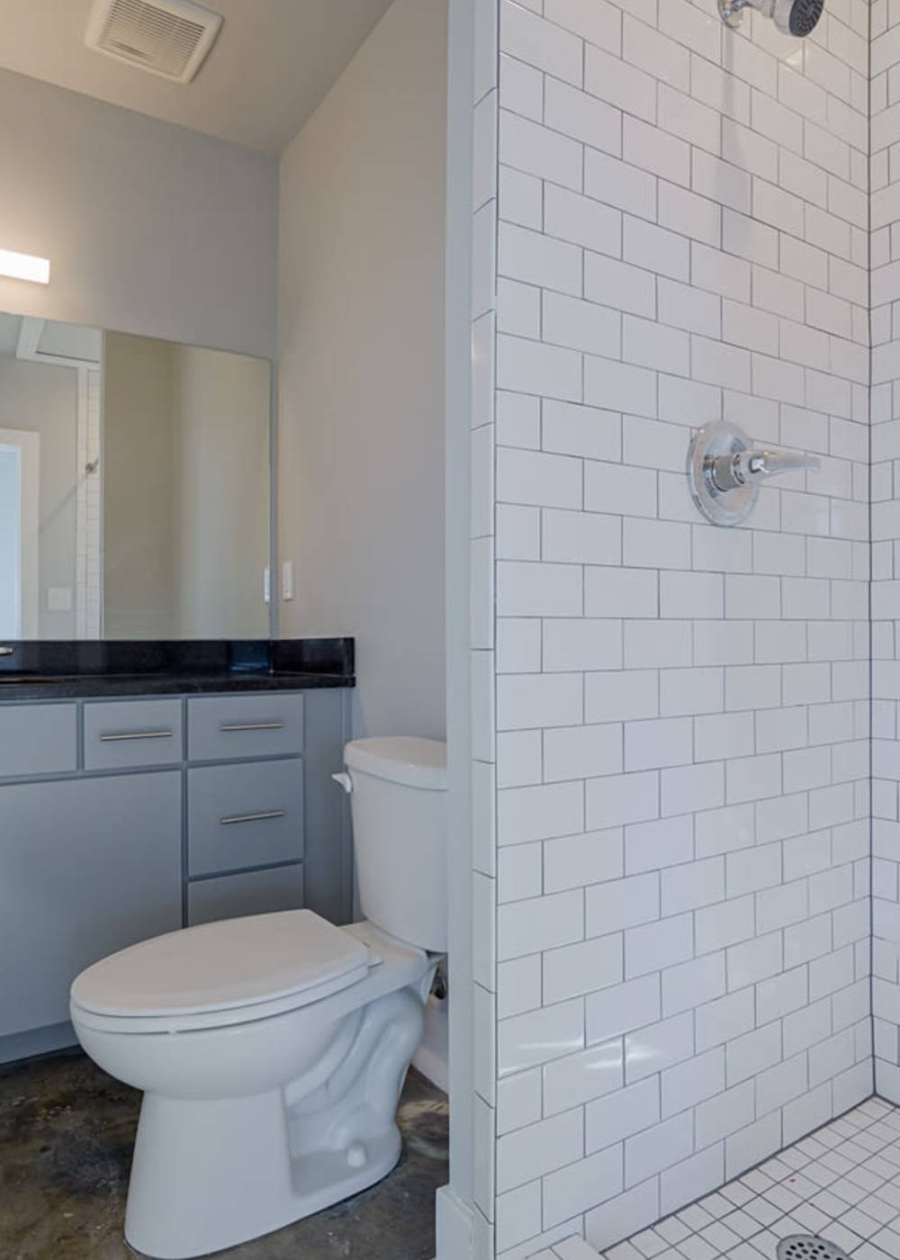 A tiled apartment bathroom at Eclipse Apartments in Richmond, Virginia