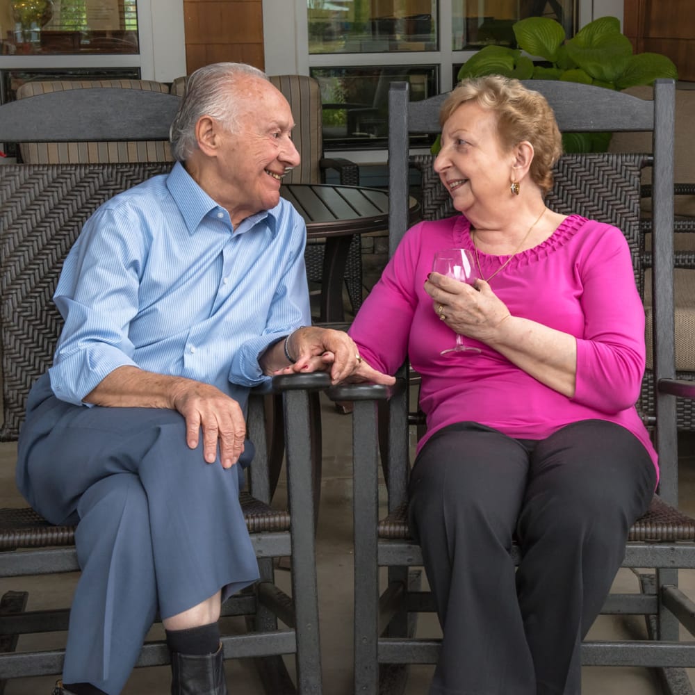 Resident chatting on the patio at The Springs at Sunnyview in Salem, Oregon