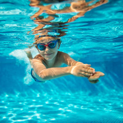 Kid enjoying in pool at Nantucket Apartments in Santa Clara, California 