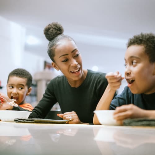 A mother and her children at home at Canyon View in San Diego, California