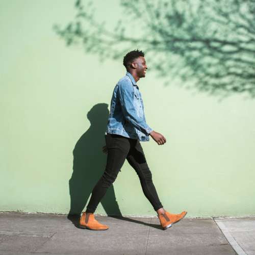 Resident walking in the downtown near Charleston Square Apartments in Columbus, Indiana