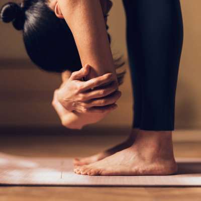 Woman doing yoga on her apartment at Greentree in Indianapolis, Indiana