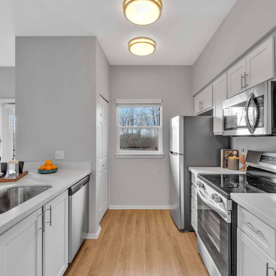 Kitchen overlooking the spacious living room at The Meadows in Tacoma, Washington