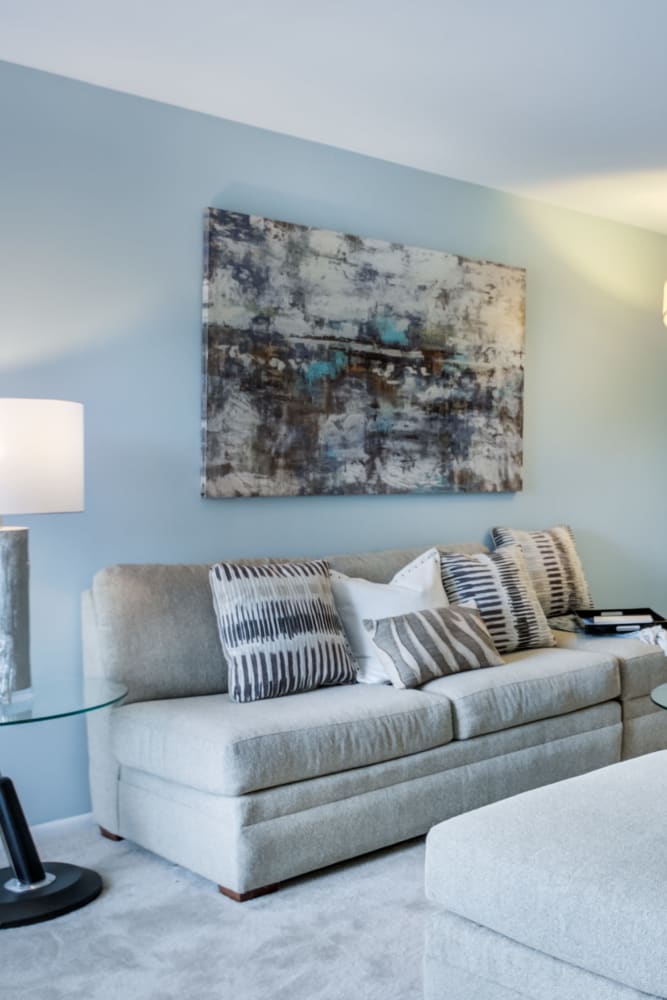 Model living room with wall-to-wall carpeting at Montgomery Woods Townhomes in Harleysville, Pennsylvania