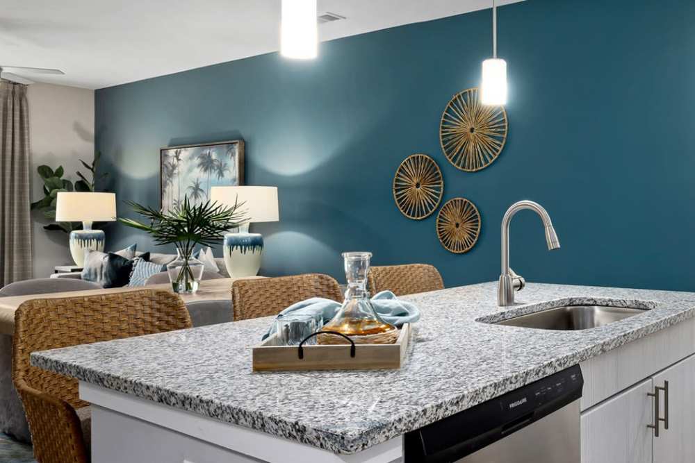 Spacious dining room with kitchen table, ceiling light, and easy access to sink and dishwasher at Hudson Carolina Forest in Myrtle Beach, South Carolina