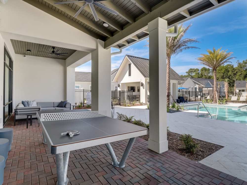 Ping-pong table and swimming pool at Cottage Street at eTown in Jacksonville, Florida
