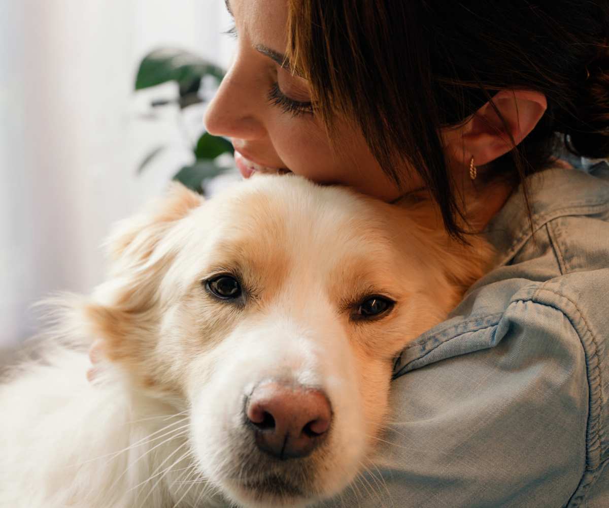 Resident with pet dog at Timbercreek in Toledo, Ohio