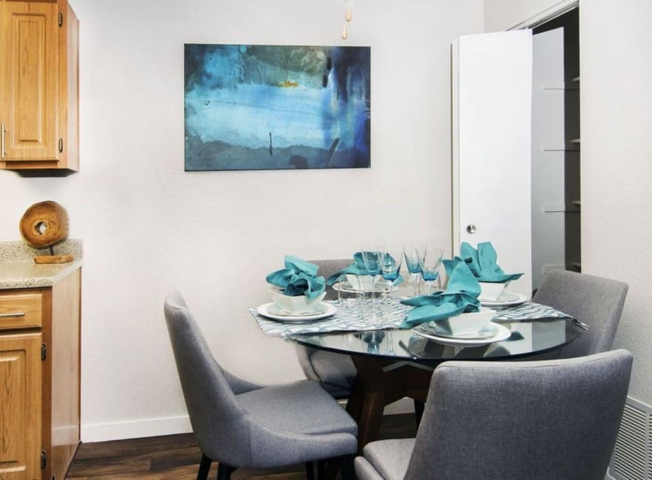 Cozy dining area with seats for four in a model home at Greenwood Plaza in Centennial, Colorado