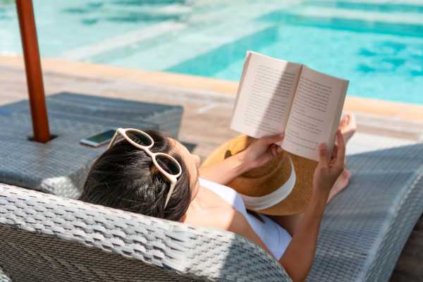 Reading by the pool at Waters Edge in Sacramento, California