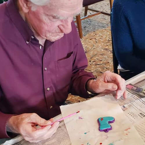A resident crafting at Canoe Brook Assisted Living & Memory Care in Catoosa, Oklahoma