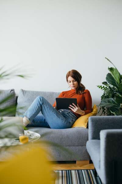 Woman in her cozy couch at Tryon Farms in Charlotte, North Carolina