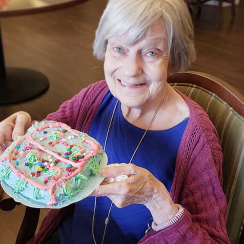 A resident with cake at Canoe Brook Assisted Living & Memory Care in Catoosa, Oklahoma