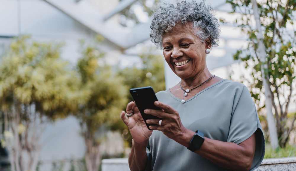Resident using phone at Huntington Place in Trumbull, Connecticut