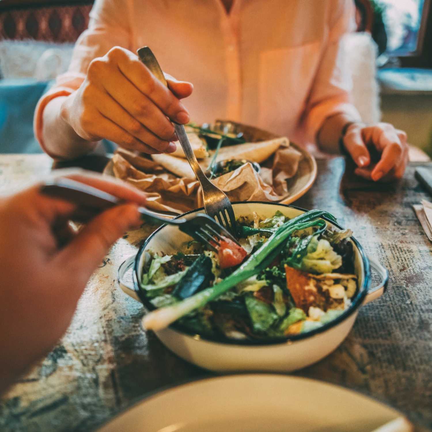 Residents eating at a restaurant near Cambridge Apartments in Athens, Georgia