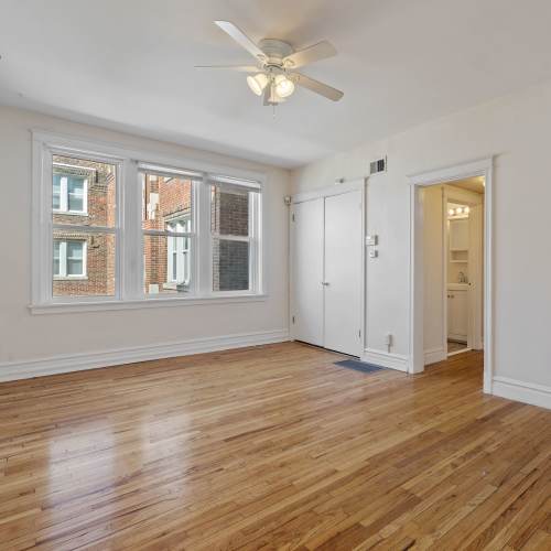 Unfurnished living room with ceiling fan at Central West End Apartments in Saint Louis, Missouri