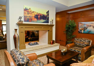Gorgeous interior common area showcasing fireplace at Merrill Gardens at Solivita Marketplace senior living community