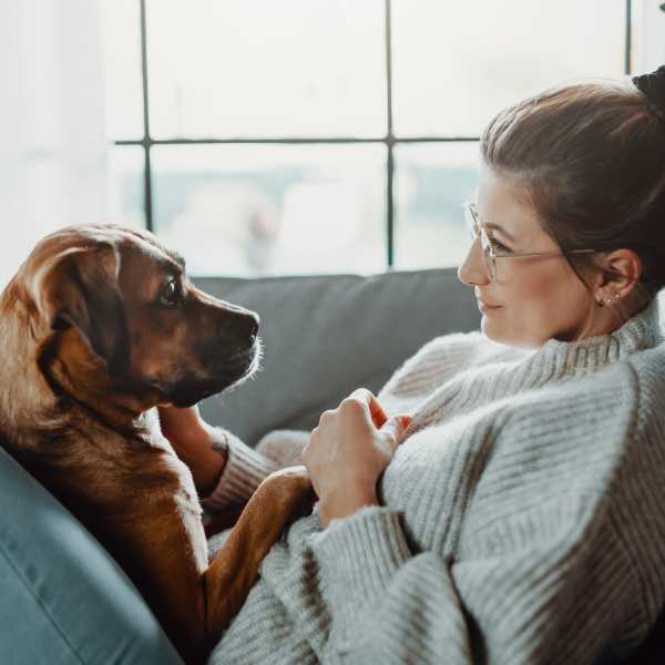 A resident enjoying time with her dog at Attain at Towne Centre, Fredericksburg, Virginia