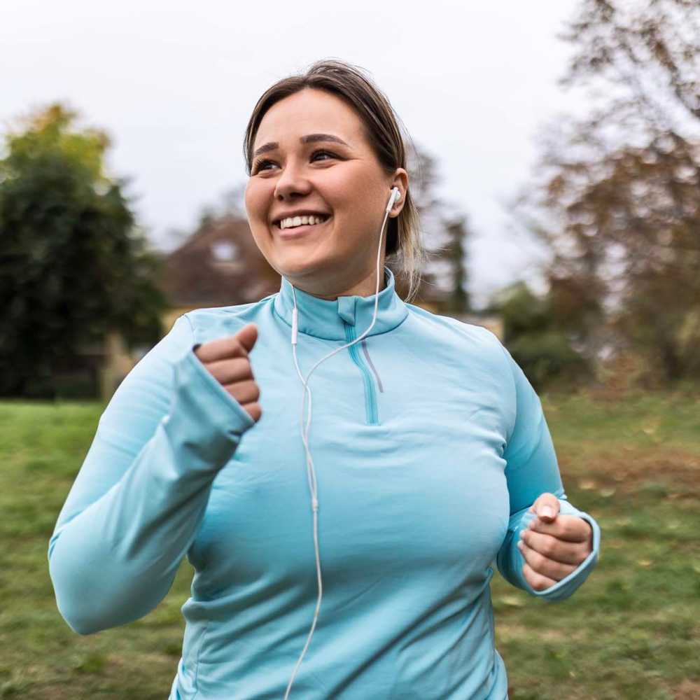 Resident woman jogging at a park near Bridgeview Village in Charleston, South Carolina