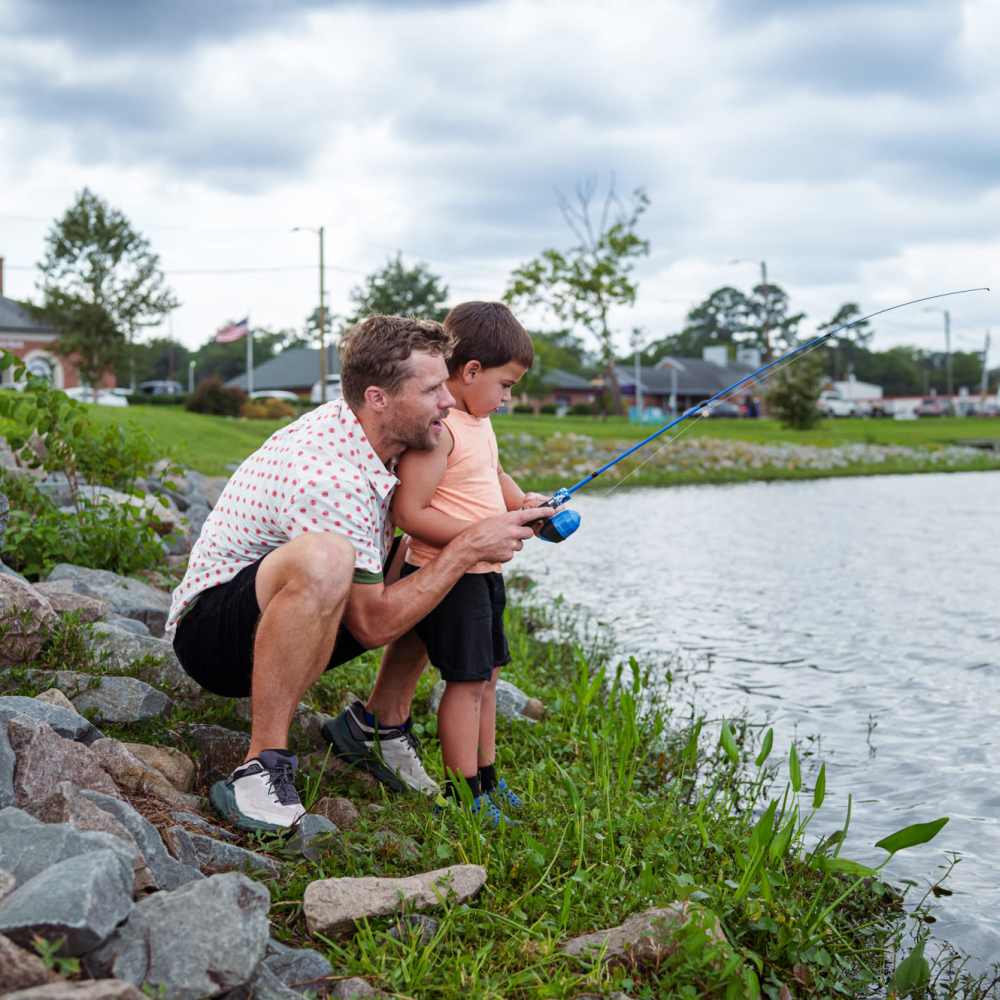 Father and son fishing near Vintage Park in Houston, Texas
