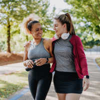 Friends jogging in a park near Palisades at Duncan in Duncan, South Carolina