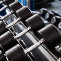 Weights at on-site fitness center at Cape At Savona Apartments in Cape Coral, Florida