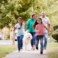 Family enjoying a neighborhood walk at Woodbrook in Gardendale, Alabama