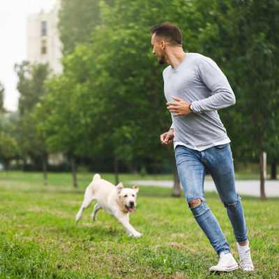 Man with his dog at Country Oaks Apartments in Hixson, Tennessee