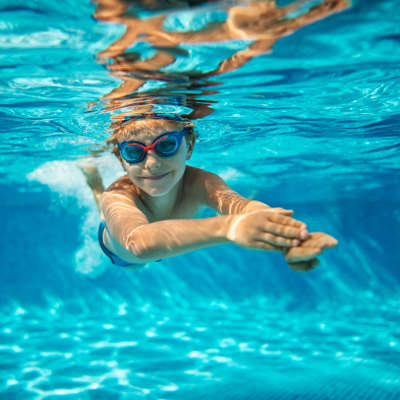 Child swimming in community pool at Century Clearbrook, Frederick, Maryland