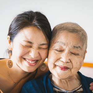 Resident and her younger family member hugging at Sunstone Village in Denton, Texas