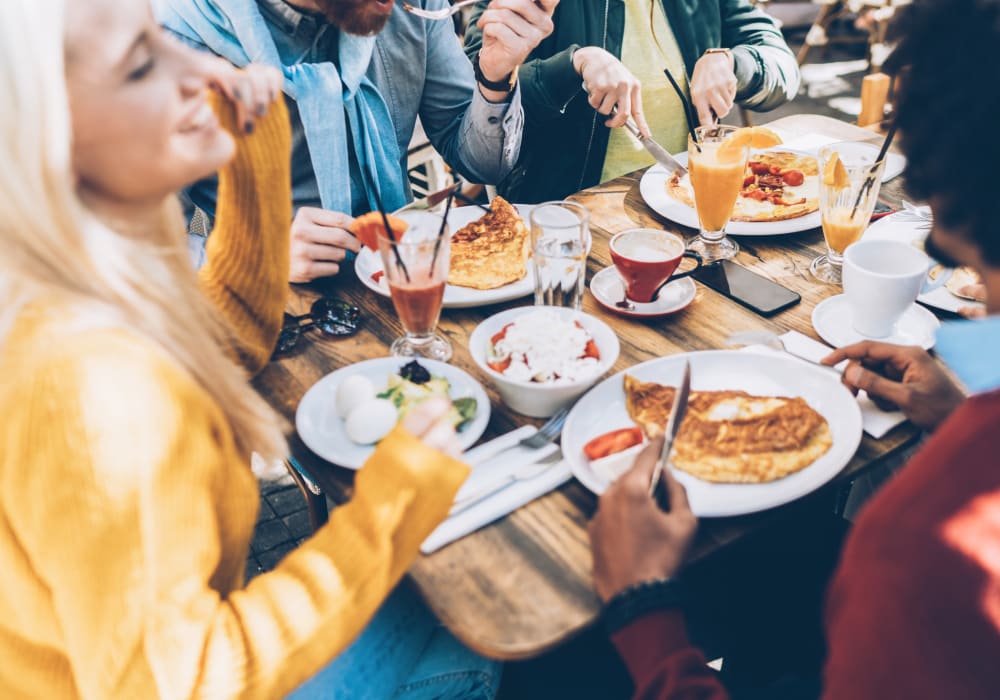 Friends enjoying breakfast together at The August Apartments in Lexington, Kentucky