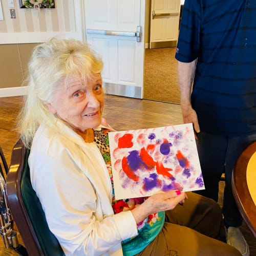 Resident painting on canvas at Saddlebrook Oxford Memory Care in Frisco, Texas