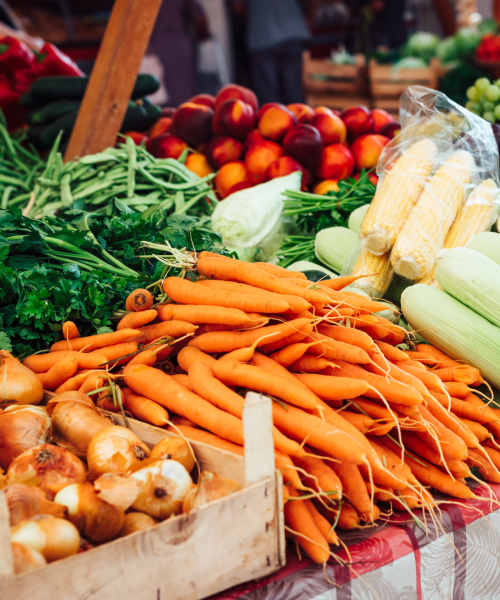 Carrots and onions in a wooden crate at Webster Glen in Peebles, Ohio