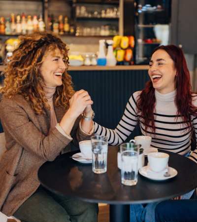 Friends eating near Gateway Park Apartments in Denver, Colorado