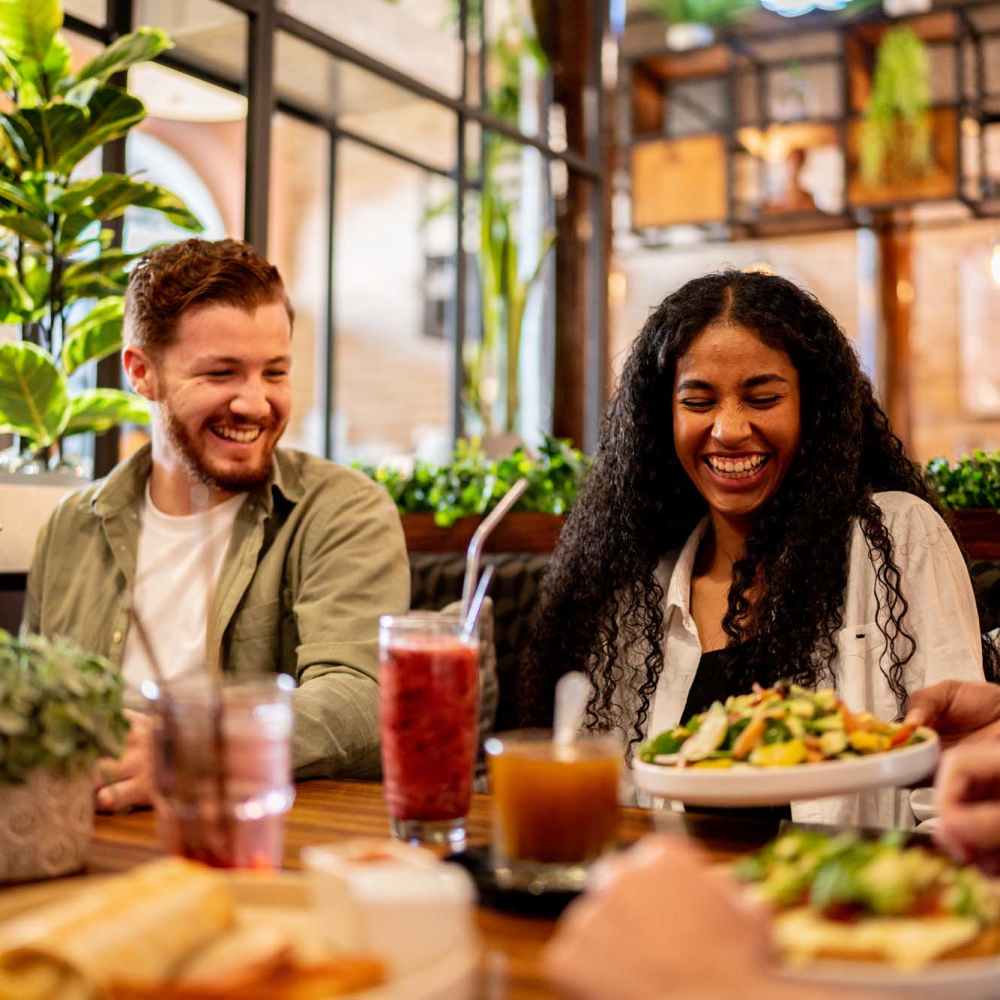 Residents having their favorite food at a restaurant nearby Village Apartments in Bellaire, Michigan