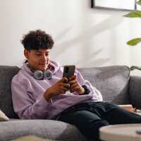 Resident using his mobile at InterUrban Apartments in Billings, Montana