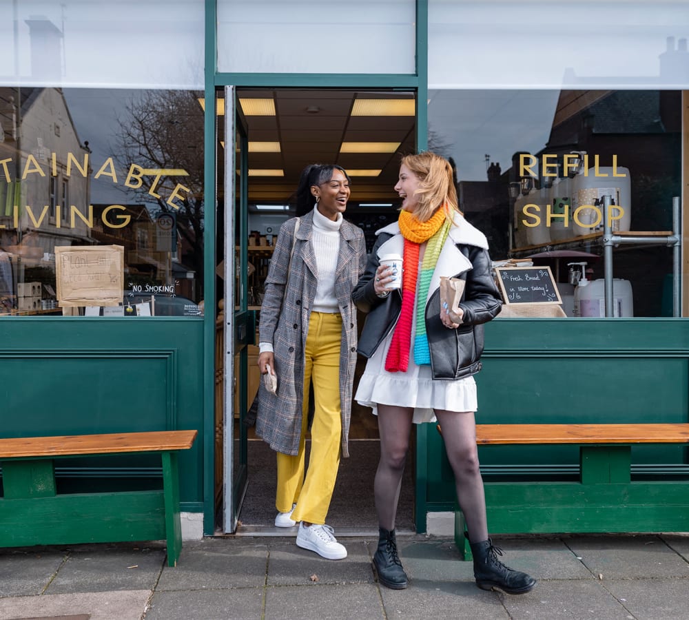 Two women exiting a shop near Windsor Park in Woodbridge, Virginia