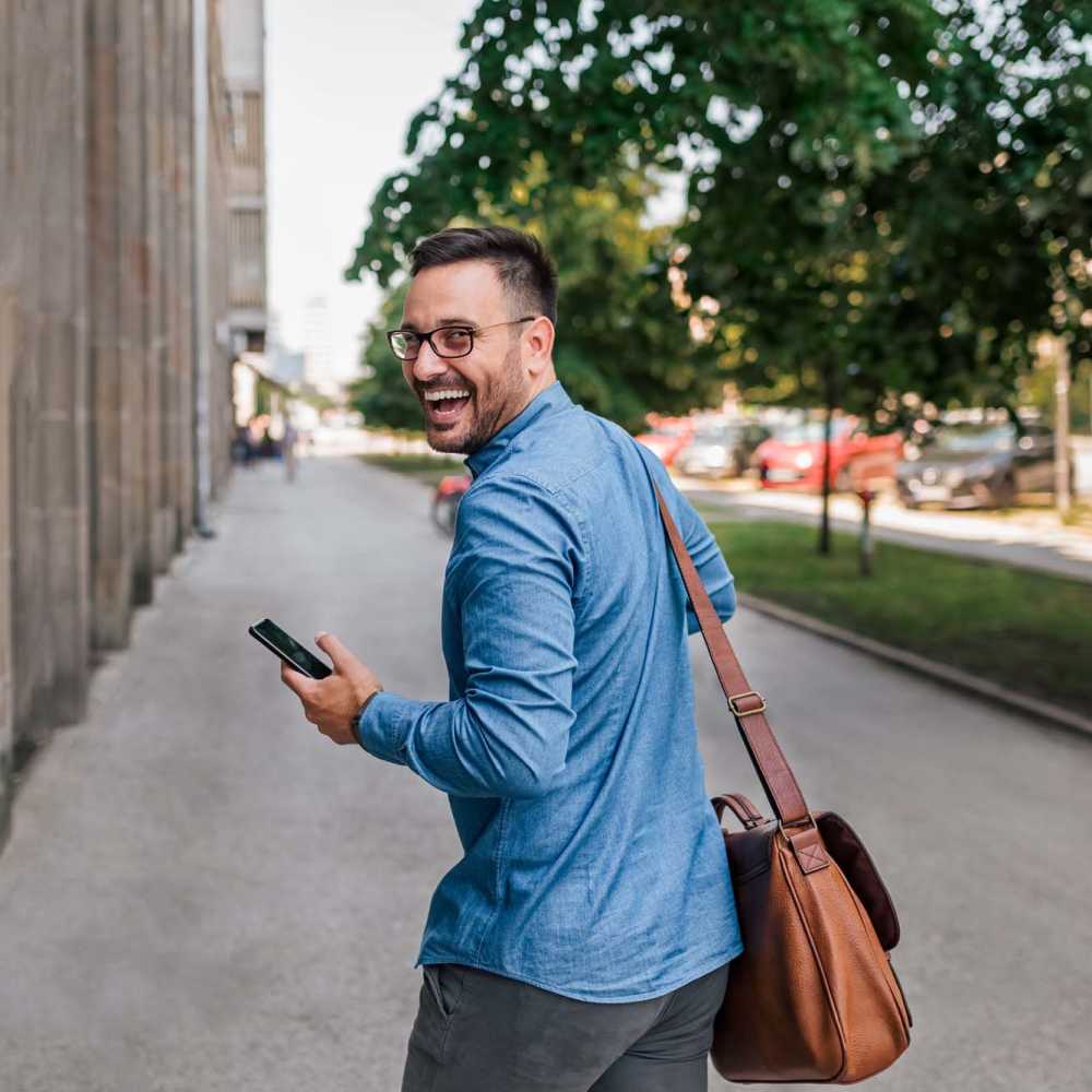 Resident smiling outside of Red Knot at Edinburgh in Chesapeake, Virginia