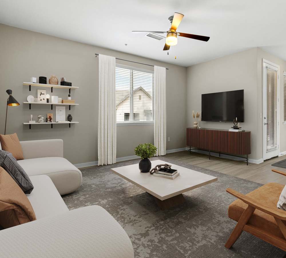 Well decorated living room with ceiling fan and area rug at The Parc at Greenwood Village in Greenwood Village, Colorado
